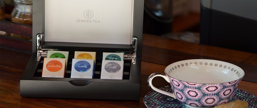 Wooden display box for premium tea in hospitality accommodation